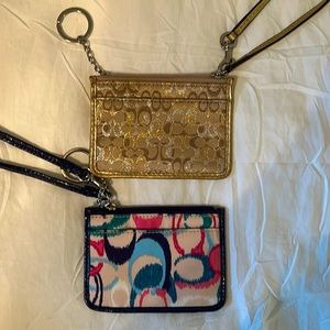Two coach wristlets.   Gold is EUC. Blue NWT.